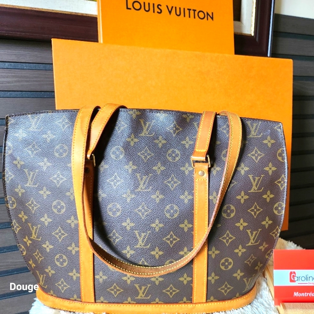 - Authentic Louis Vuitton BABYLONE Tote Shoulder Bag.